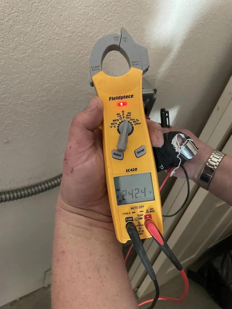 Voltage testing with clamp meter during Ceiling Fan Installation in Oak Hills